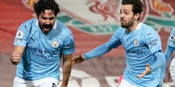 Man City tightens title grip at Anfield