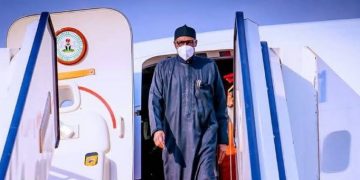 Buhari Returns to Abuja After African Finance Summit in France