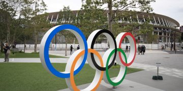 Tokyo Olympics official dies after jumping in front of train