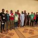 National Embarrassment: Nigeria’s Contingent Arrive Tokyo In Arsenal Jerseys
