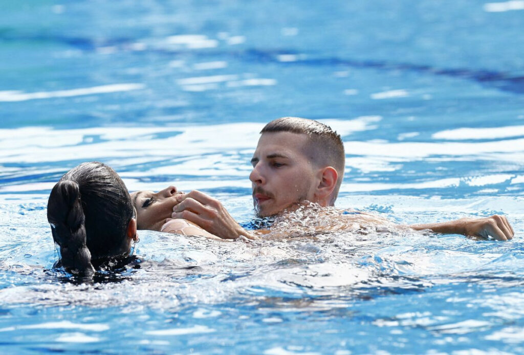 PHOTOS: US Coach Rescues Swimmer After Athlete Faints In Pool During World  Championships - Heritage Times