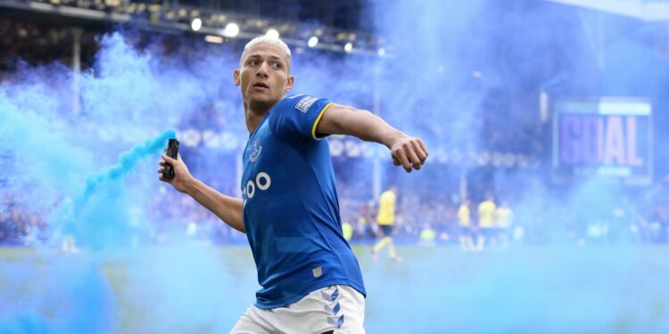 LIVERPOOL, ENGLAND - MAY 01:  Richarlison of Everton celebrates his goal with a flare during the Premier League match between Everton and Chelsea at Goodison Park on May 01, 2022 in Liverpool, England. (Photo by Tony McArdle/Everton FC via Getty Images)