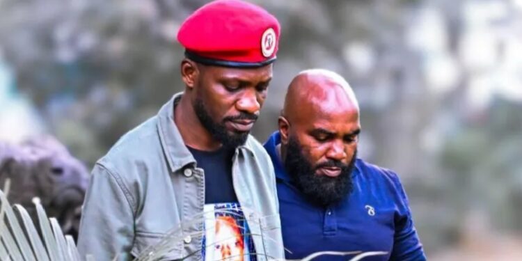 Bobi Wine (left) and his bodyguard Eddie Mutwe (right)