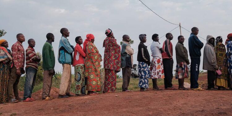 Voters queue as they wait to cast their ballots for the Burundi legislative elections at Musama Primary School in Gitega on June 5, 2025.