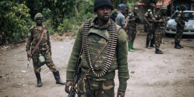 A Democratic Republic of Congo soldier is seen on patrol in the village of Manzalaho, near Beni, Feb. 18, 2020, following an alleged attack by members of the Allied Democratic Forces (ADF) rebel group