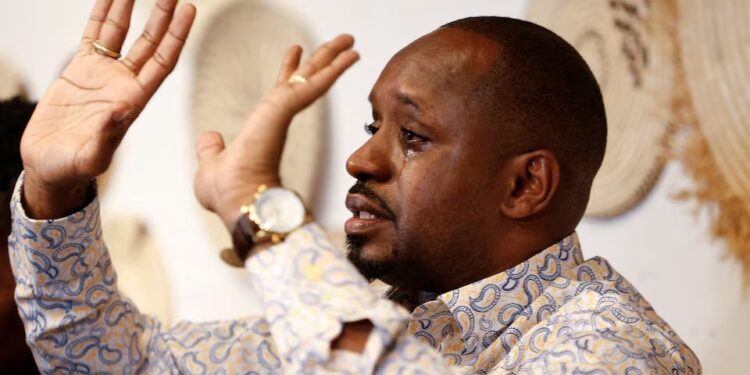 Kenyan activist Boniface Mwangi, who was detained upon arrival in Dar es Salaam to attend the first court appearance of Tanzanian opposition leader Tundu Lissu, and later released, reacts at a press conference in Nairobi, Kenya June 2, 2025..
