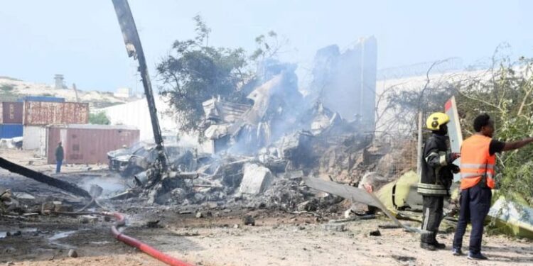 Rescue efforts take place after a Ugandan military helicopter crashed at Aden Adde airport in Mogadishu, Somalia, on Wednesday, July 2, 2025
