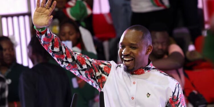 Boniface Mwangi making gesture while declaring his intention to run for presidency