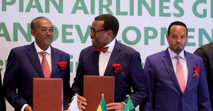 Ethiopian Airlines Chief Commercial Officer, Lemma Yadecha, African Development Bank President Akinwumi Adesina and Ethiopia's Finance Minister Ahmed Shide attend a signing ceremony of the Abusera Mega Airport construction finance agreement