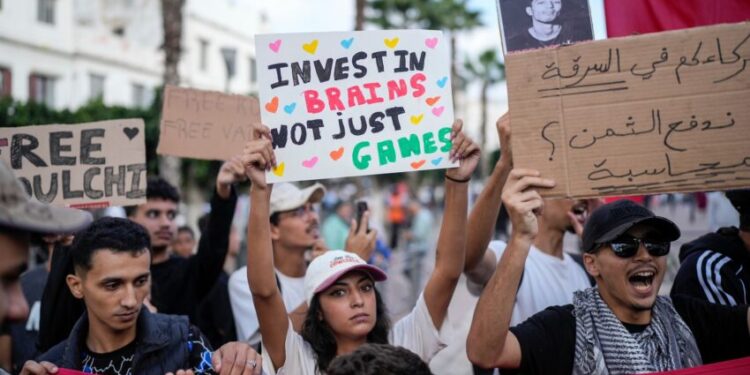 People take part in a youth led protest against corruption and calling for healthcare and education reforms, in Casablanca, Morocco, Sunday, Oct. 5, 2025. (AP Photo/Mosa'ab Elshamy)