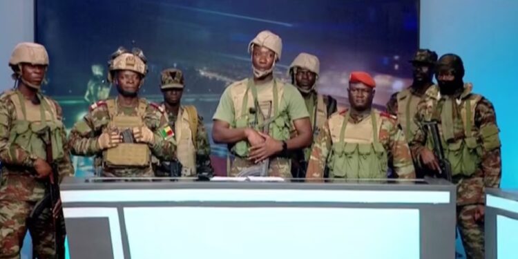 A group of soldiers gives a statement on Benin's national television, claiming to have seized power