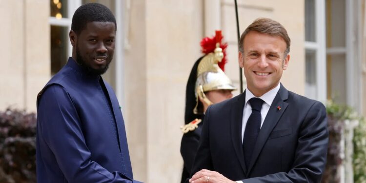French President Emmanuel Macron welcomes Senegal's President Bassirou Diomaye Faye for a meeting at the Elysee Palace in Paris on June 20, 2024