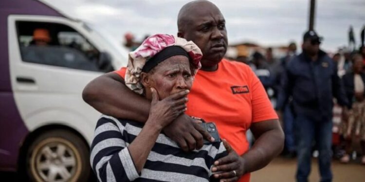 Bekkersdal residents at the scene of the shooting