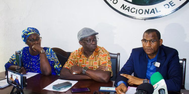 Officials of Guinea-Bissau's electoral commission address the media in Bissau, Guinea-Bissau, December 2, 2025. The commission said on Tuesday it was unable to complete the November 23 presidential election process after armed men seized ballots and vote tallies from its offices, while servers storing the results were destroyed.