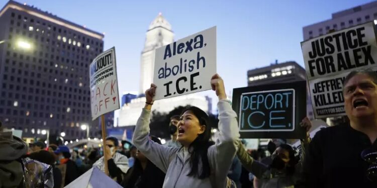 Demonstrators gathered at the Federal Building for a peaceful protest in support of a 37-year-old man shot and killed by immigration officers in Minneapolis