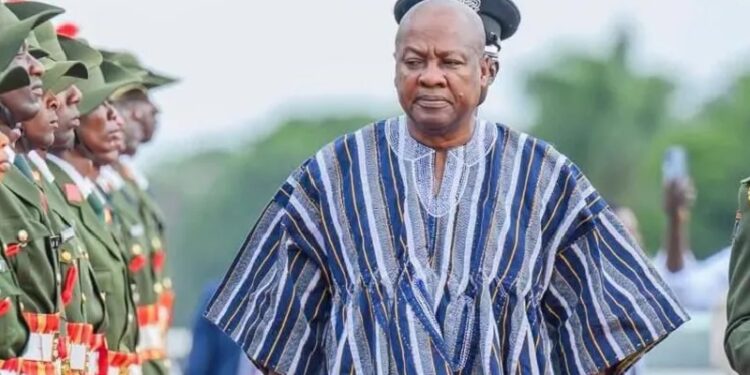 President John Dramani Mahama putting on the fugu traditional wear