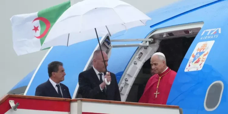 Pope Leo XIV exits an airplane at Algiers’ Houari Boumédiène International Airport on Monday, , at the start of an 11-day apostolic journey to Africa.