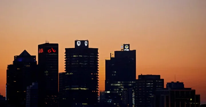 The buildings with the logos of three of South Africa's biggest banks, ABSA, Standard Bank and First National Bank (FNB) are seen against the city skyline in Cape Town, South Africa, September 3, 2017