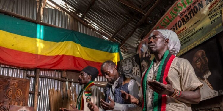 Rastafarians perform prayers following meditative chants accompanied by Nyabinghi drumming at a Rastafari commune in Nairobi, on July 4, 2026.