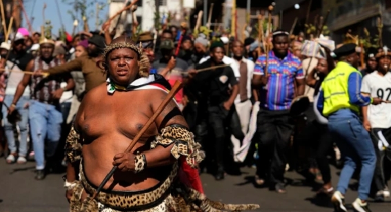 A protester dressed traditional attire marches against illegal immigration, in Johannesburg, South Africa, June 30, 2026