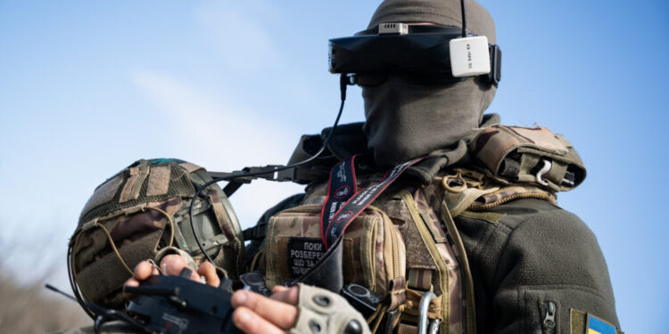 A Ukrainian soldier performs a trial with an FPV drone in the region of Kharkiv, Ukraine, on March 19, 2025. (Photo by Alfons Cabrera/NurPhoto)NO USE FRANCE